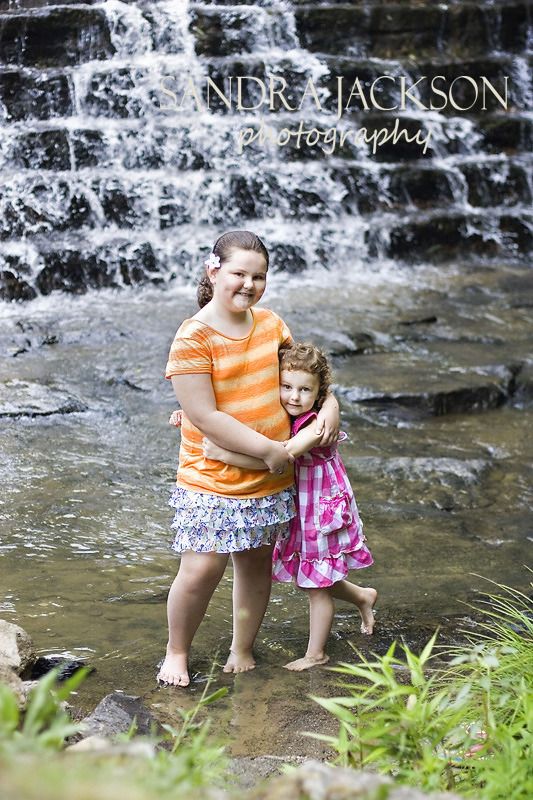 Girls by waterfall