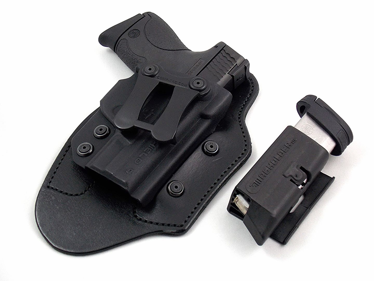 The author's carry gun, holster, and extra mag holder.