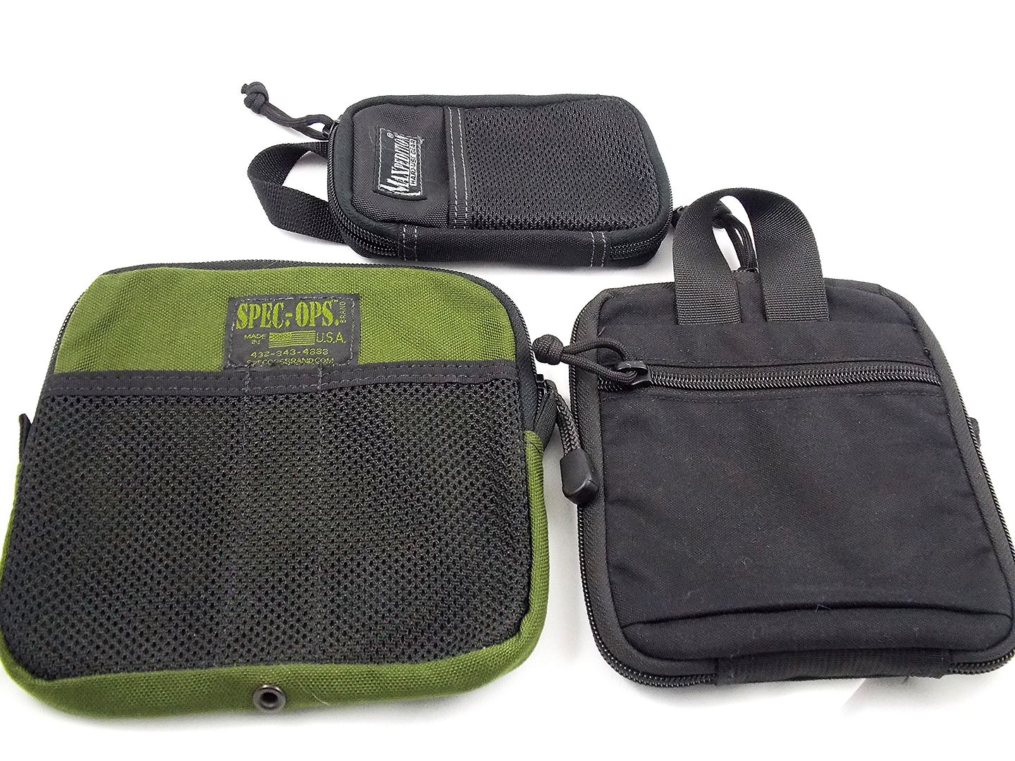Clockwise from top, the Maxpedition Micro Organizer, THE-E Pocket Organizer and the Spec Ops Cargo Pocket Organizer